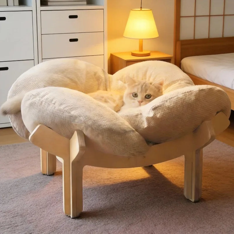 Elevated plush cat bed with a soft removable cushion and wooden legs for indoor cats and small dogs